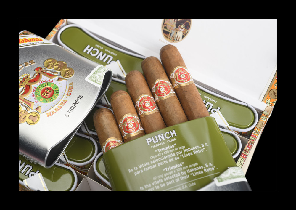 The aluminum boxes contain 5 Punch Trifunos from the Habanos retro line.